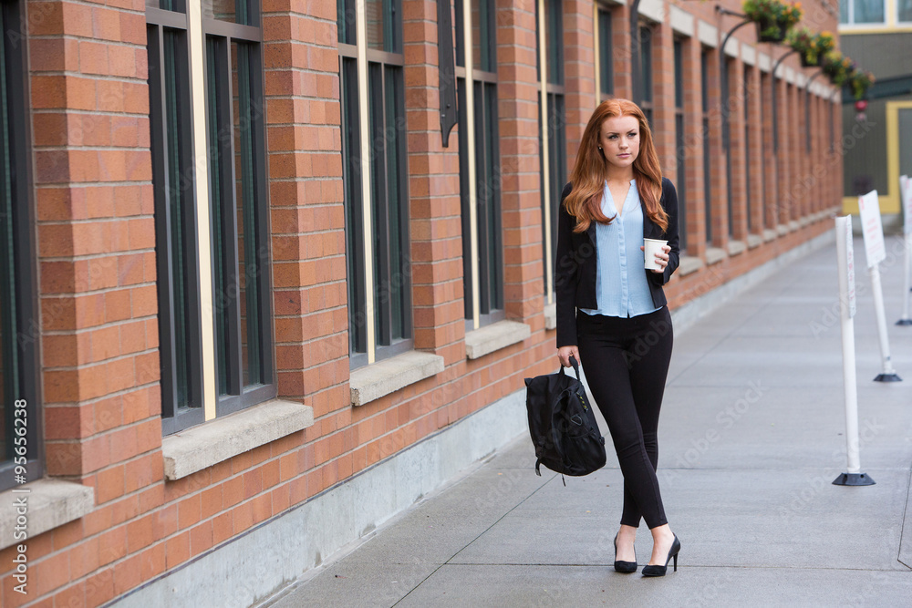 Redhead business woman outside