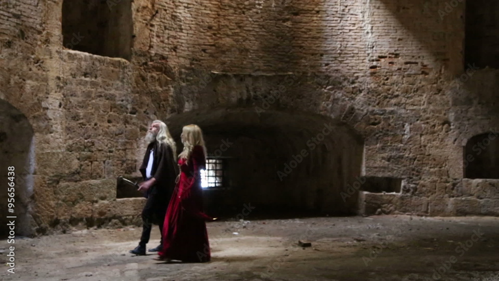 Knight and princess walking trough basement of fortress 1 of 2 Knight and princess walking trough basement of fortress 1 of 2