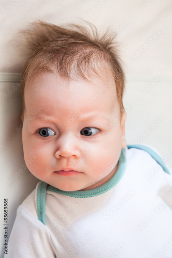 disheveled baby looking sideways disheveled baby looking sideways