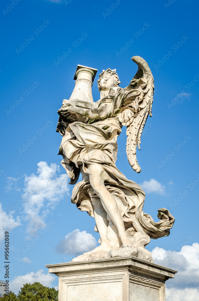 Naklejka premium Stone statues of angels and apostles Eliyev on the bridge over the River Tiber leading to Castel Sant'Angelo in Rome, capital of Italy near the Vatican