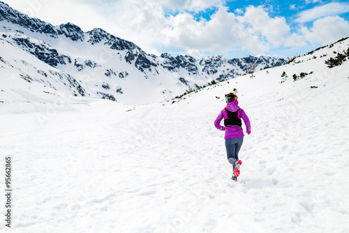 Happy woman winter trail running in beautiful inspirational land © blas