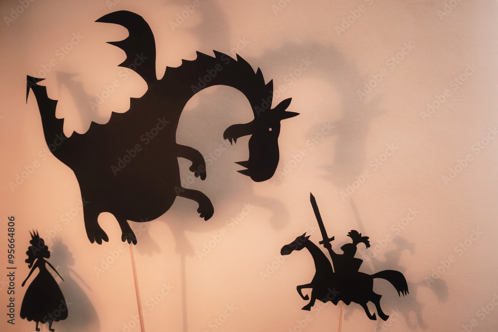 Naklejka premium Shadow Puppets of Dragon, Princess and Knight z jasnym świecącym ekranem teatru cieni w tle.