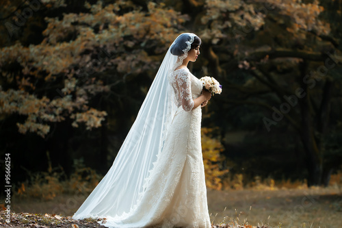 Young bride in forest