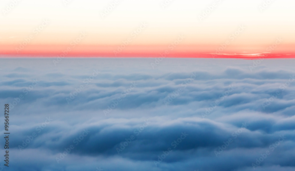 misty clouds and sunset at the clear horizon