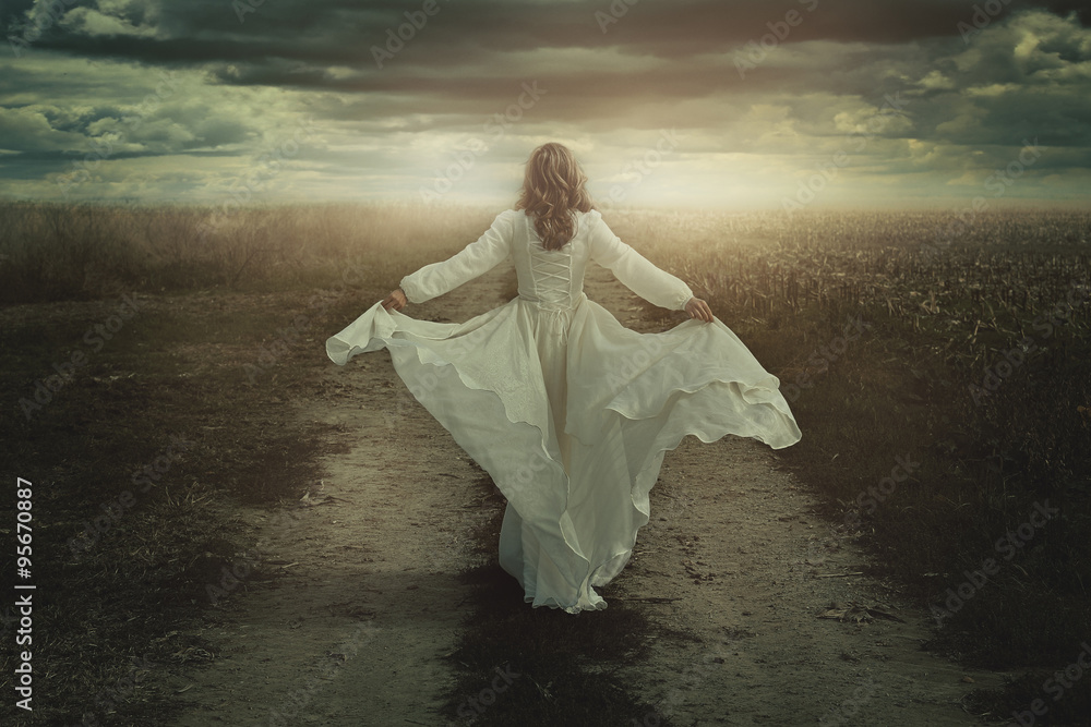 Woman running free in a desolate land Woman running free in a desolate land