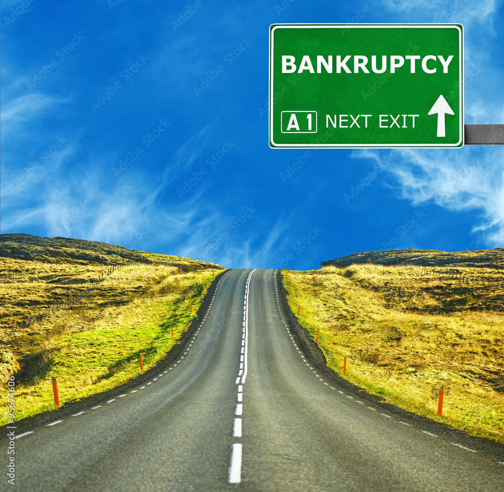 BANKRUPTCY road sign against clear blue sky
