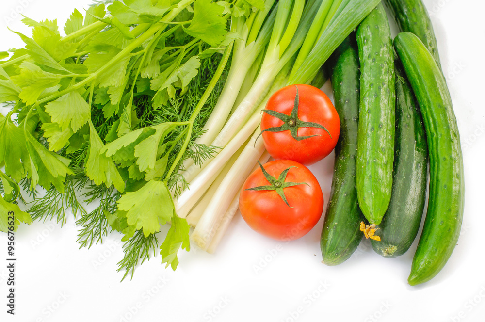 Two tomatoes and lettuce, cucumber, on the white background
Two tomatoes and lettuce, cucumber, on the white background