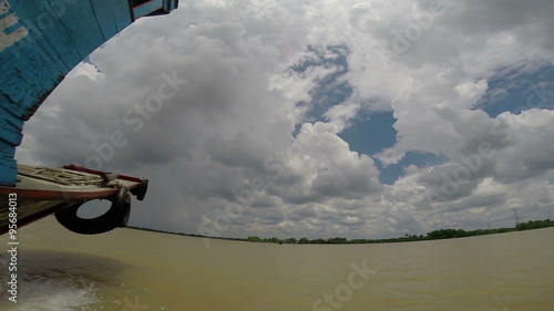 Boat floating Mekong Delta river Vietnam photo