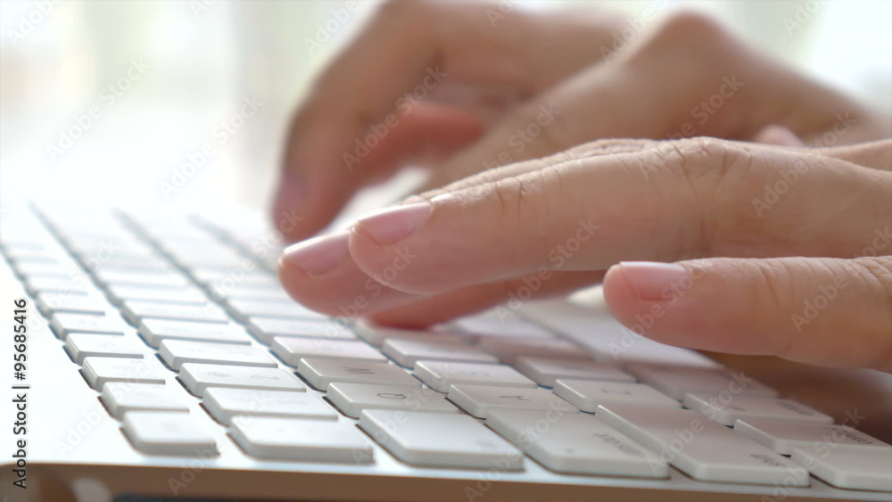 Woman's hands typing on modern computer keyboard. Freelancer use the internet to work from home. Woman's hands typing on modern computer keyboard. Freelancer use the internet to work from home.