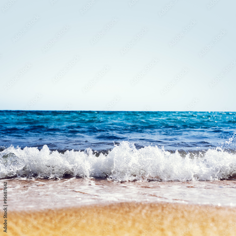 Wave of the sea on the sand beach