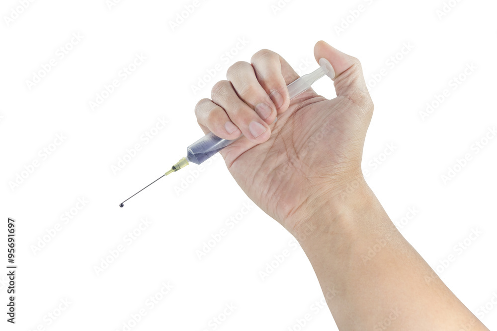 Hand holding a syringe Hand holding a syringe