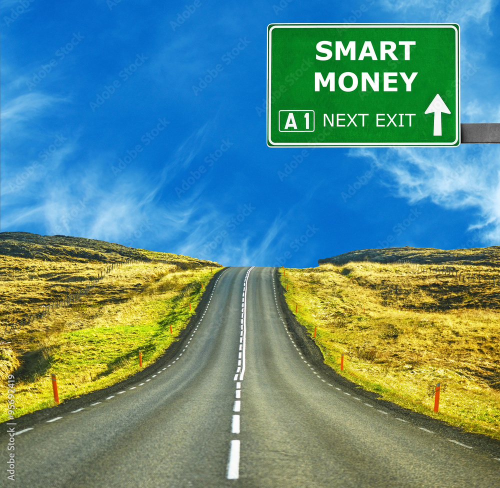 SMART MONEY road sign against clear blue sky