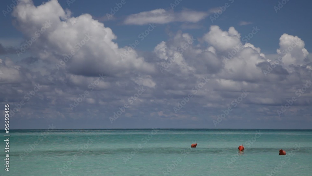 Calm sea, blue sky and white clouds