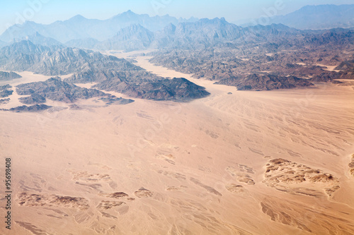 The Horeb mountains in Egypt on Sinai Peninsula with Sahara desert, aerial view photo