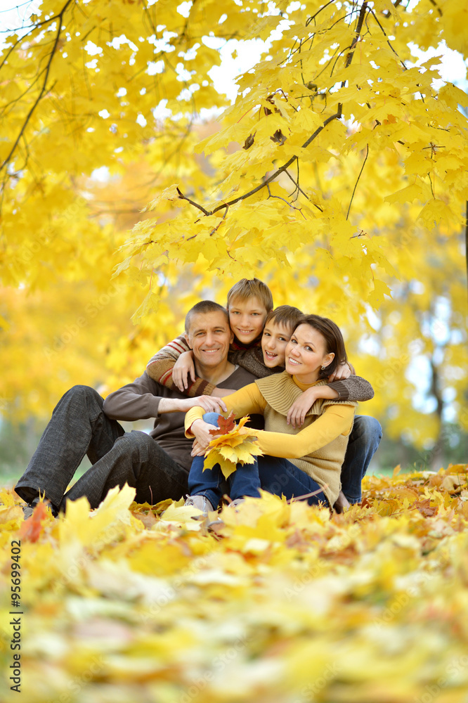 Family sitting on grass Family sitting on grass