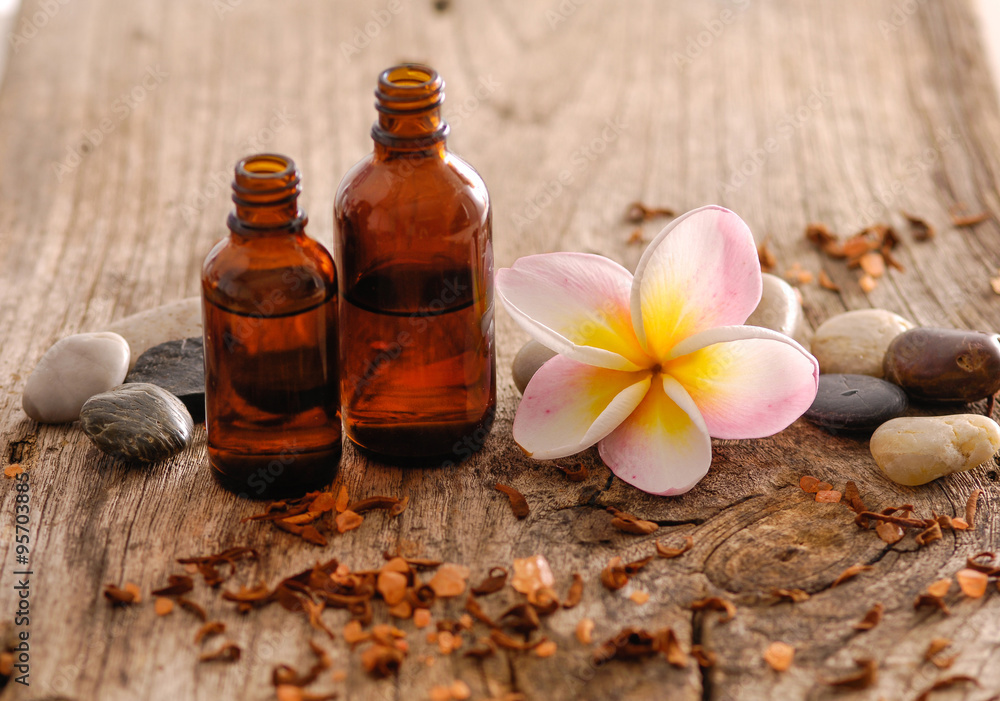 frangipani with stones ,massage oil on old wood
frangipani with stones ,massage oil on old wood
