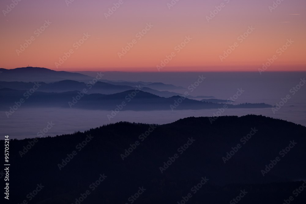sunset over fog in Black Forest, Germany sunset over fog in Black Forest, Germany