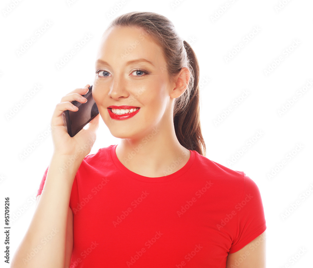 Woman using a mobile phone isolated on a white background Woman using a mobile phone isolated on a white background