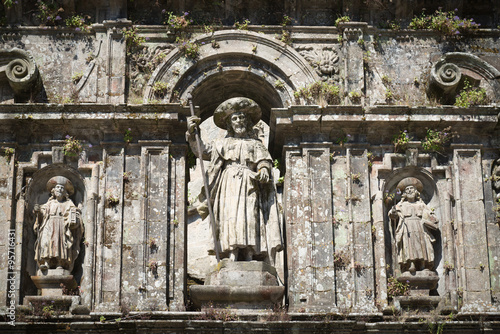 Decorative piece of wall above the entrance to the Cathedral of St. James in Santiago de Compostela in Spain photo