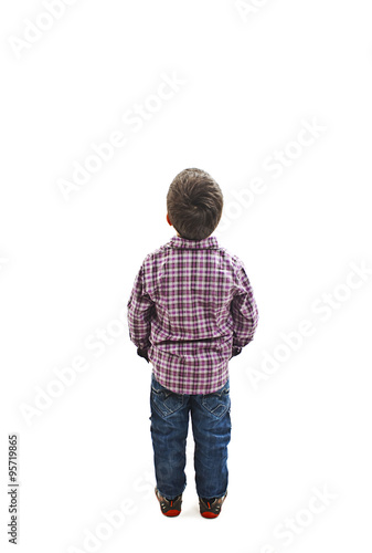 Back view of little boy looking at wall. Rear view. Isolated on white background 