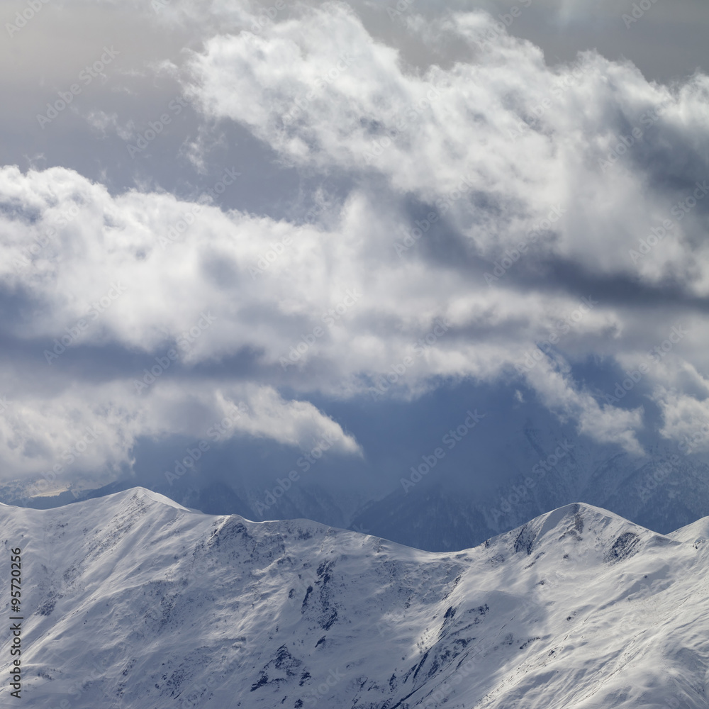 Evening mountains and sunlight cloudy sky