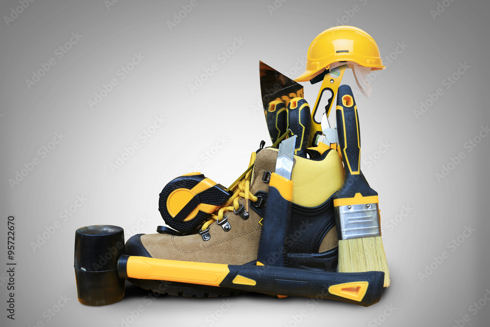 Obraz premium Shoe construction with tools and construction helmet