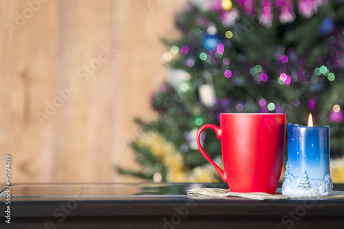 Intimate view of the cup and candle in Christmas