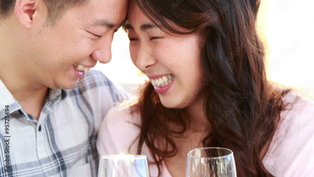 Happy couple holding flutes of champagne Happy couple holding flutes of champagne