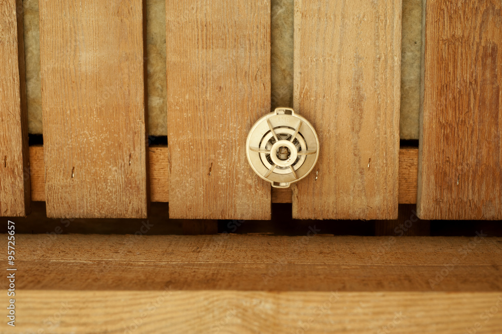 Fototapeta premium smoke detector in a wooden house