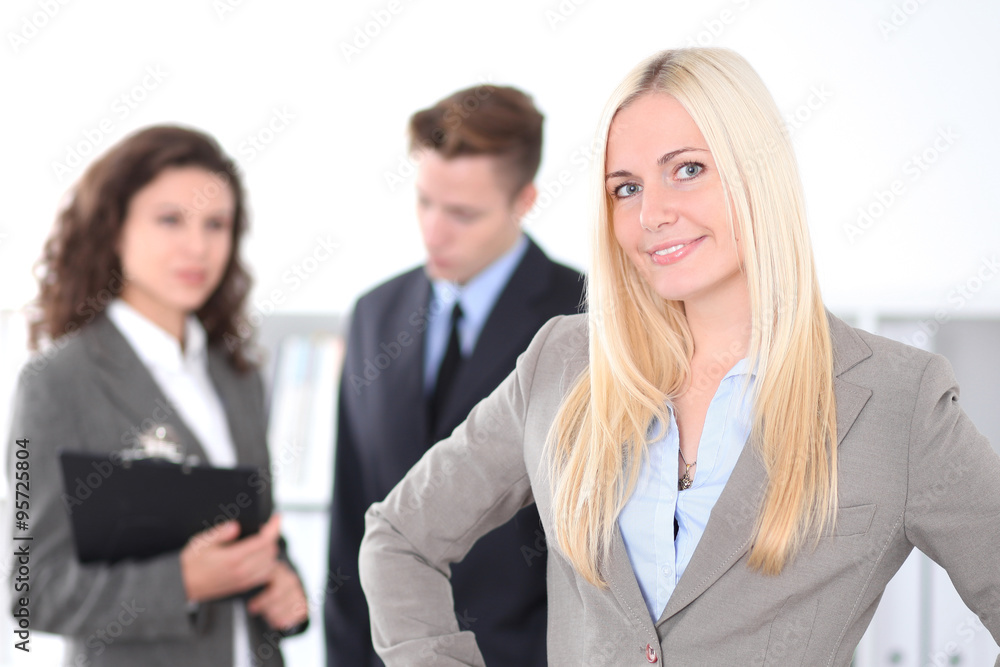 Face of beautiful cheerful smiling business woman on the background of business people Successful business concept Face of beautiful cheerful smiling business woman on the background of business people Successful business concept