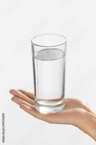 Water. Health And Diet Concept. Drinks. Woman's Hand Holding Glass Of Water.