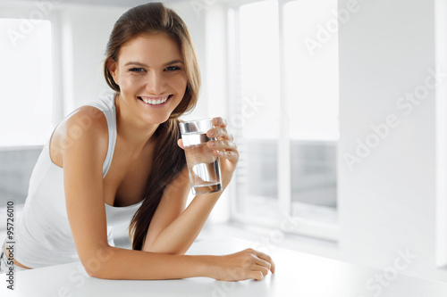 Healthy Lifestyle. Happy Woman With Glass Of Water. Drinks. Health, Diet, Beauty. photo