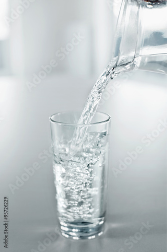 Drinking Water. Pour Water From Pitcher Into A Glass. Health, Diet, Hydratation Concept.