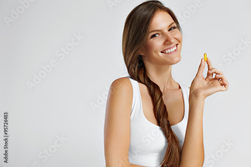 Vitamins. Healthy Eating. Happy Girl With Omega-3 Fish Oil Capsule. Healthy Diet Concept.