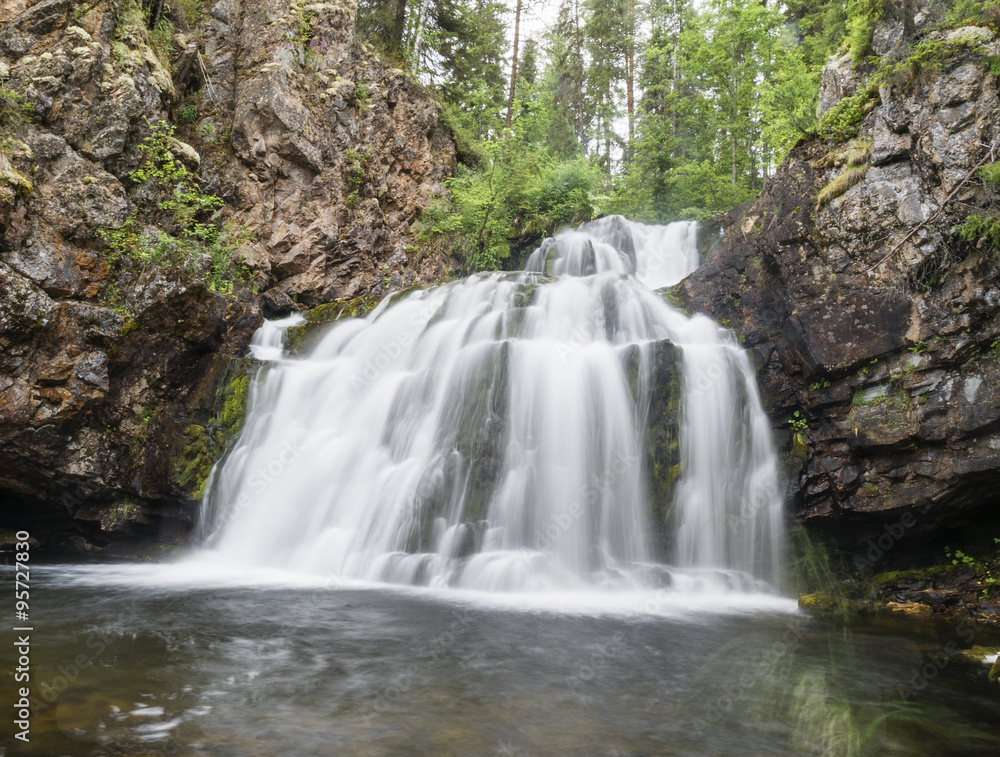 Wild waterfall Myantyukoski, three steps stone cascade in Paanaj?rvi National Park
