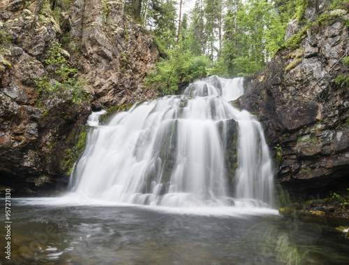Wild waterfall Myantyukoski, three steps stone cascade in Paanaj?rvi National Park