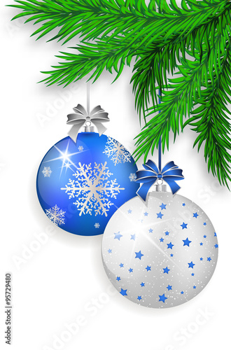 Blue and silver Christmas balls hanging on spruce twig