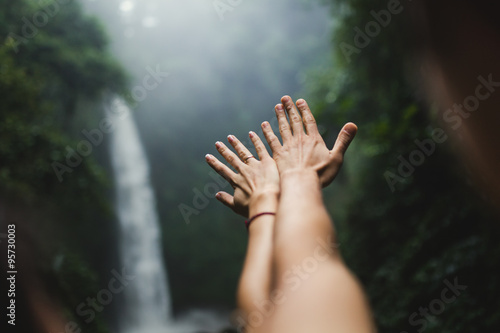 hands outstretched in the Waterfalls