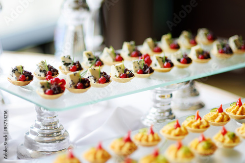 Plates with assorted snacks on an event party