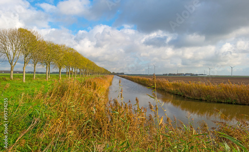 Canal through a rural landscape in autumn