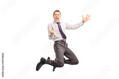 Delighted man jumping and gesturing success