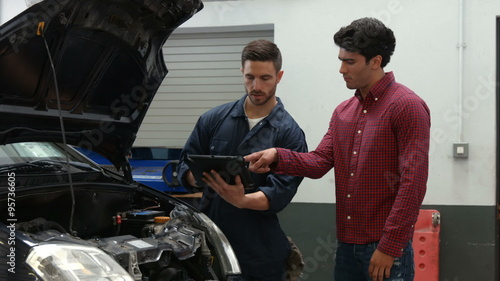 Mechanics overhauling an engine