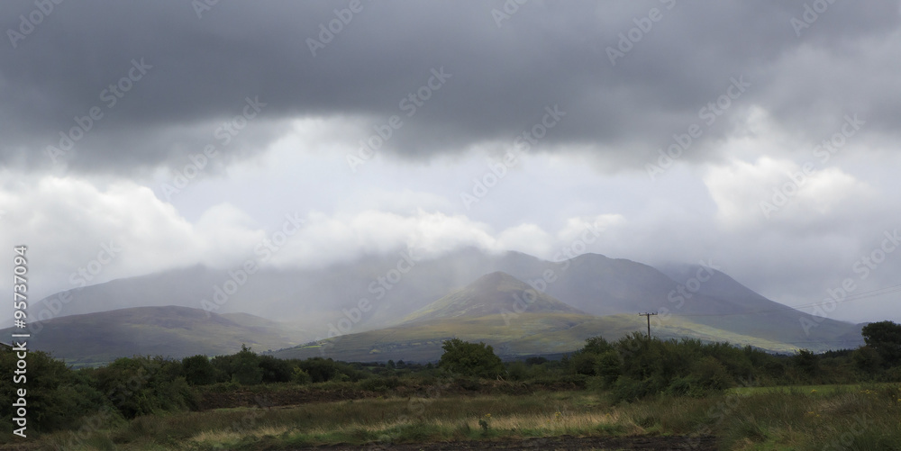 Scenic view of Kerry Mountains in thunderclouds 