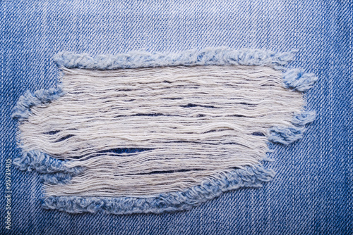 Texture of blue jeans textile close up