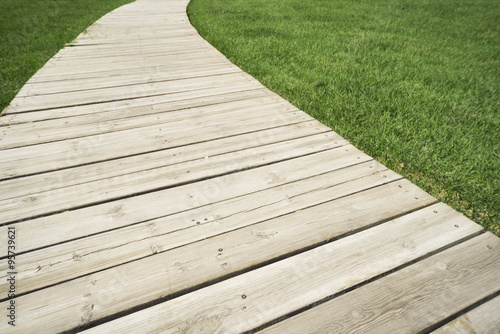 Wood plank and green grass texture background