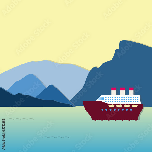 Large steamship going along the mountains at sunset. Beautiful scenery. 
