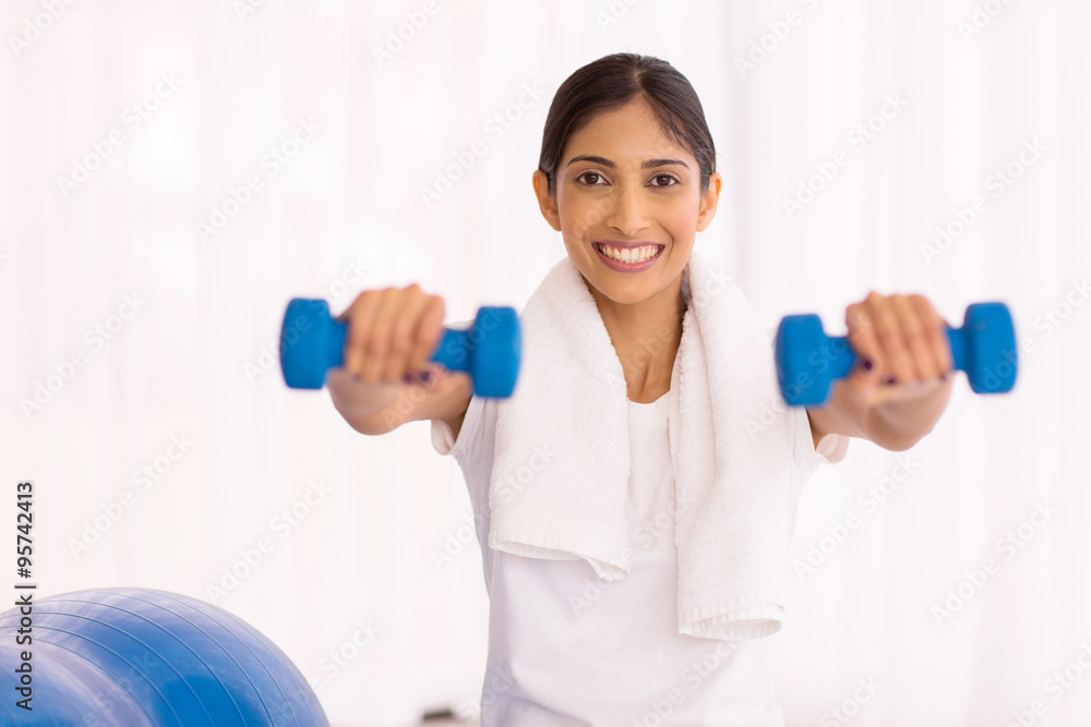 indian woman working out with dumbbells indian woman working out with dumbbells