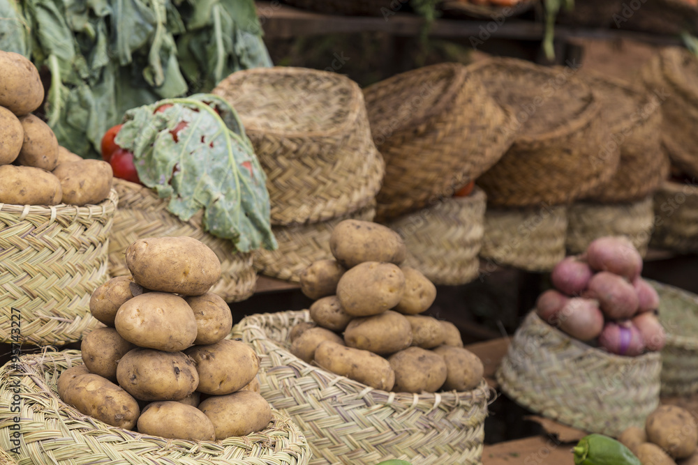 Potatoes in baskets on a vegetables market Potatoes in baskets on a vegetables market
