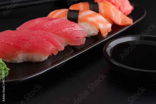 Premium quality sushi rolls with over black background