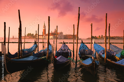 Venice with famous gondolas at gentle pink sunrise light, © Taiga